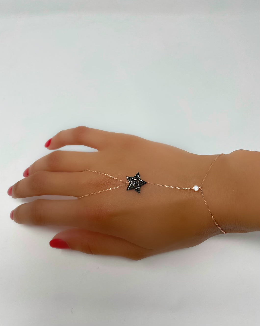 Star finger bracelet.